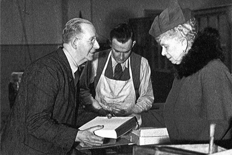 Queen Mary standing with George Bayntun inside the shop, archival photograph.